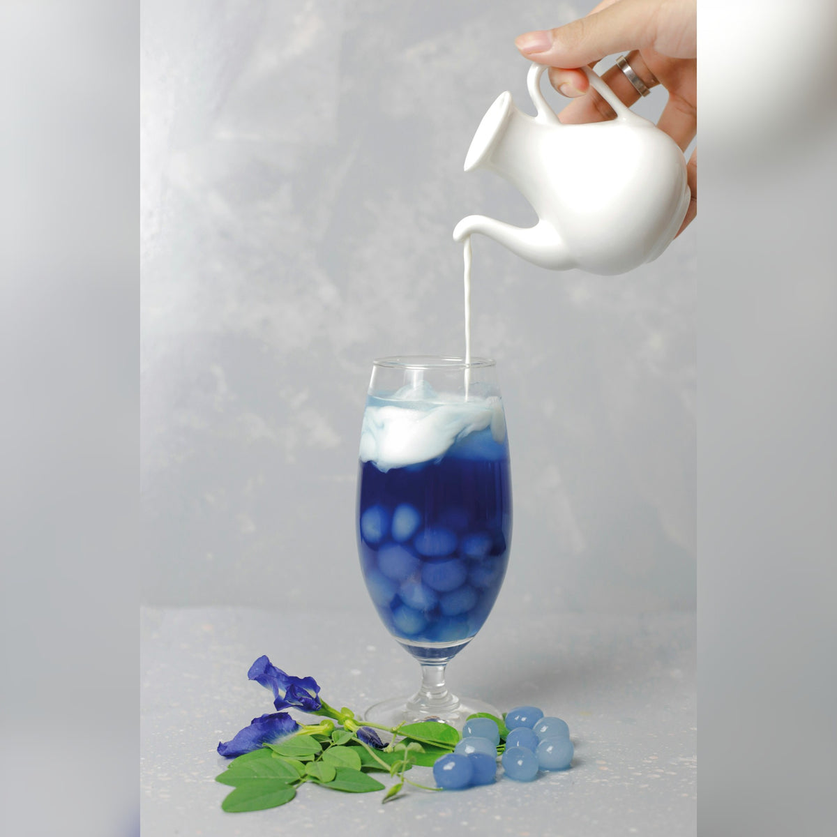 Butterfly pea flower tea poured over ice
