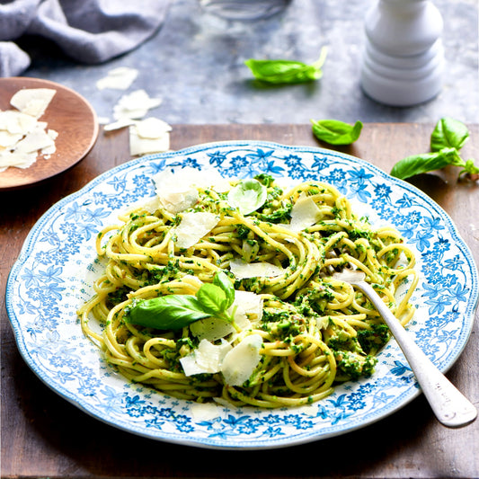 Spaghetti tossed in green pesto