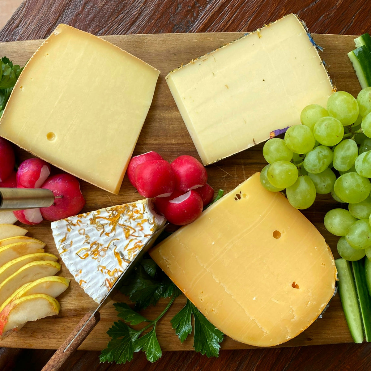 Green grapes on a cheese board